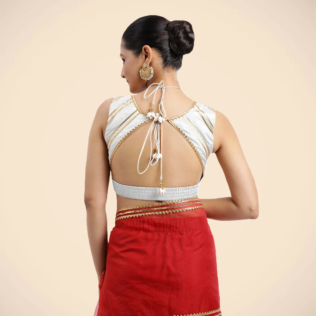 Ahana x Tyohaar | Pearl White Sleeveless FlexiFit™ Saree Blouse with Plunging Neckline and Back Cut Out with Tasteful Golden Gota Lace Embellishment